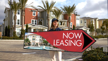 Woman with advertising sign in the shape of an arrow